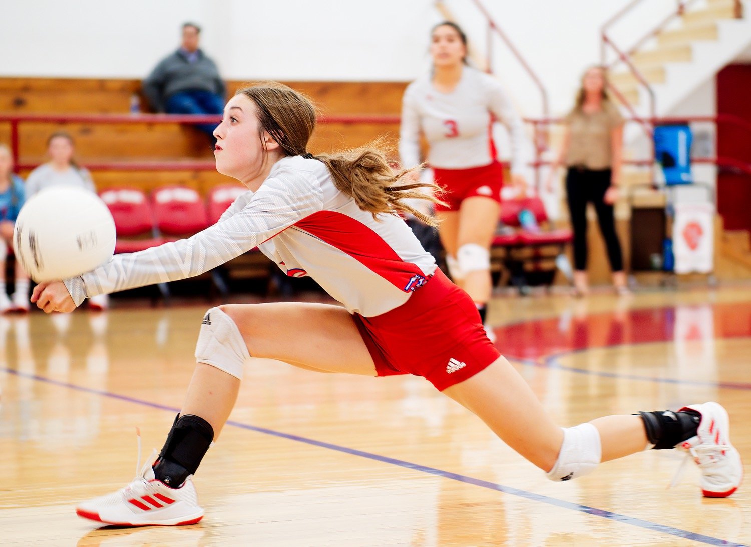 Kamrin Wright lunges forward to get the dig on a short ball. [Dig this? Get a print.]